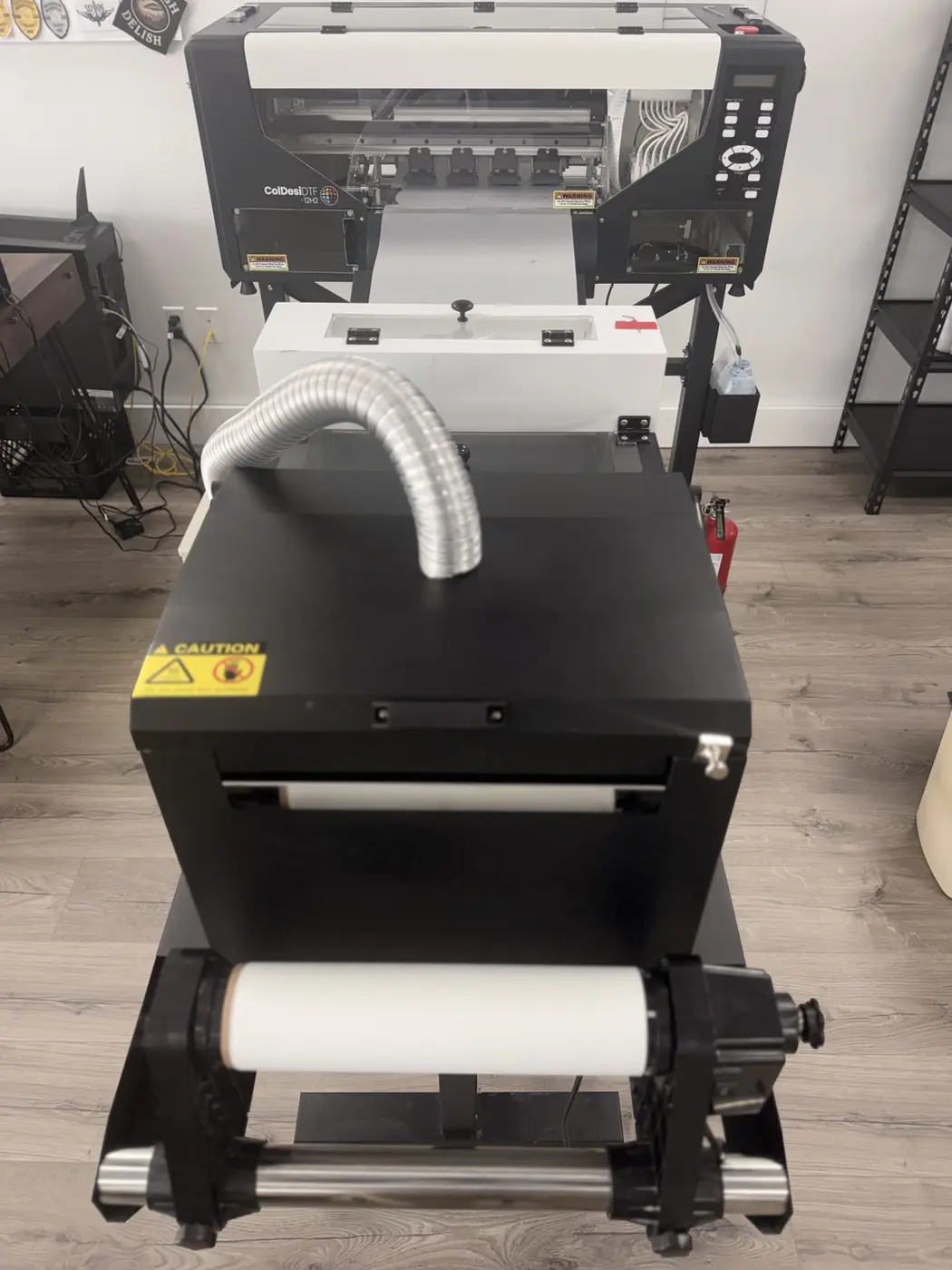 DTF printer and heat press equipment used for custom apparel